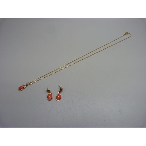 974 - A 9ct gold and coral pendant and a pair of similar earrings, 2.3g