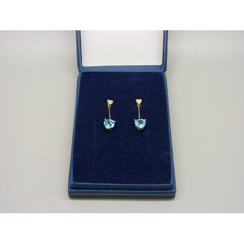 977 - A pair of 9ct gold, blue stone and diamond drop earrings