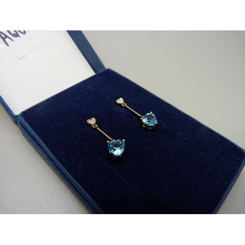 977 - A pair of 9ct gold, blue stone and diamond drop earrings