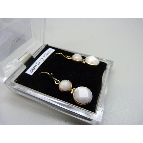 978 - A pair of silver gilt faceted moonstone drop earrings