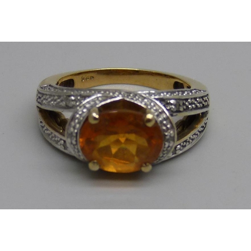 984 - A silver gilt and citrine ring with six diamond accents, N