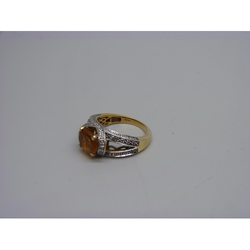 984 - A silver gilt and citrine ring with six diamond accents, N