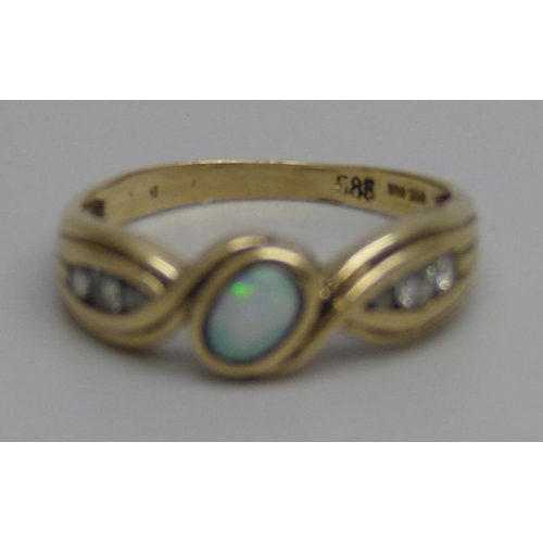 992 - A 14k gold, opal and white stone ring, 2.9g, Q