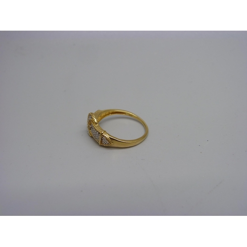 996 - A silver gilt buckle ring with a diamond accent, P