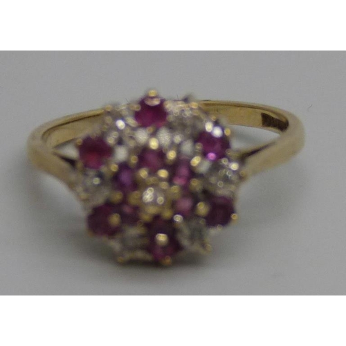 996B - A 9ct gold, ruby and diamond cluster ring, 2.6g, N