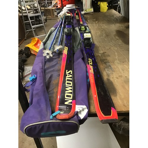 2078 - Pair of Saloman Equipe 9000 skis and poles in case