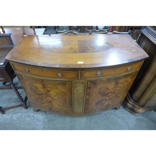 100 - A late Victorian Sheraton Revival inlaid satinwood bow front sideboard