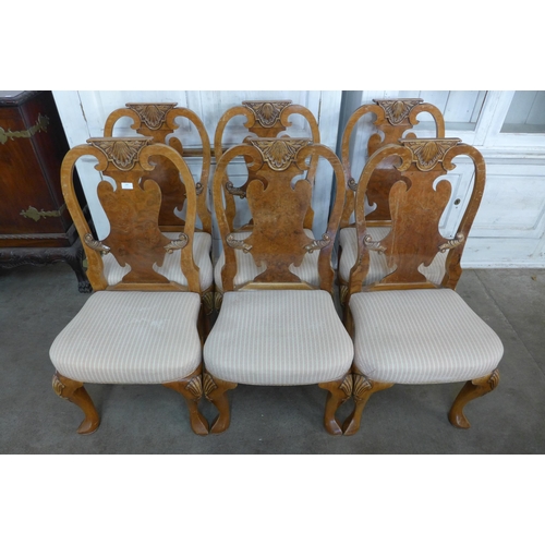 109 - A set of six Queen Anne style walnut dining chairs