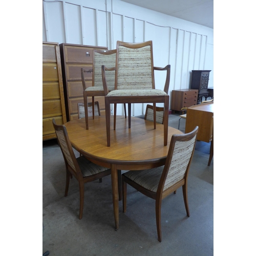 11 - A G-Plan Fresco teak extending dining table and four chairs