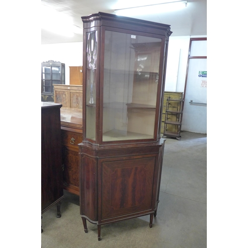 111 - An Edward VII inlaid mahogany freestanding splay front corner cabinet