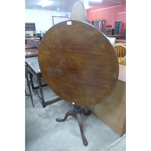 121 - A George III circular mahogany tilt-top birdcage action tripod table