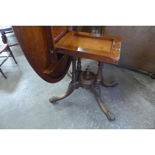 136 - A Victorian inlaid figured walnut oval tilt-top loo table