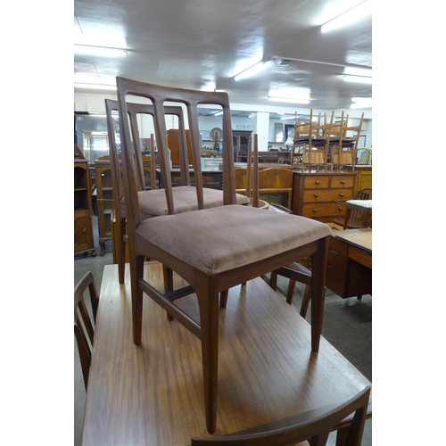 14 - A Younger tola wood extending dining table and six chairs