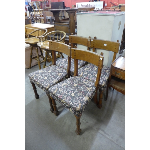 168 - A set of four Victorian Gothic Revival oak dining chairs