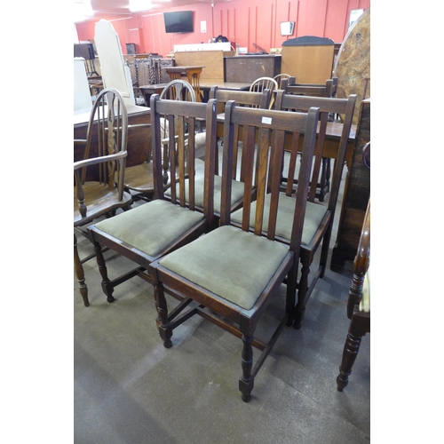 172 - A set of four oak dining chairs