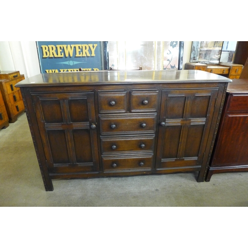 175 - An Ercol dark elm sideboard