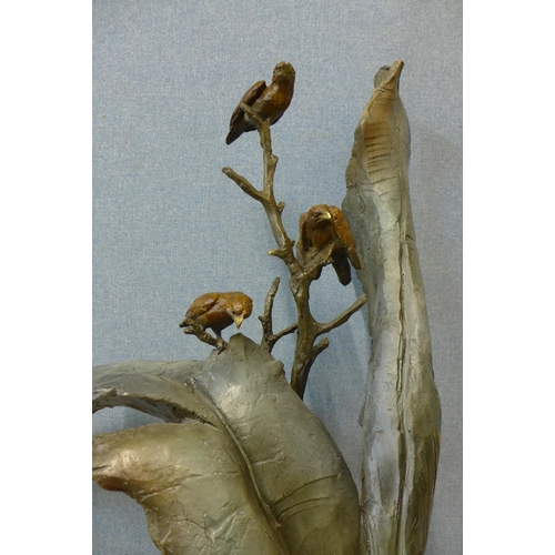 228 - A large bronze abstract sculpture of birds on a tree