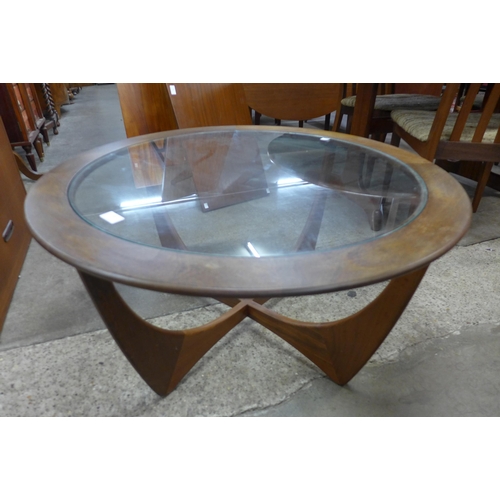 28 - A G-Plan Astro teak and glass topped circular coffee table