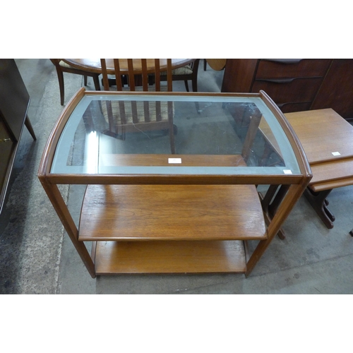 29 - A teak and glass topped trolley