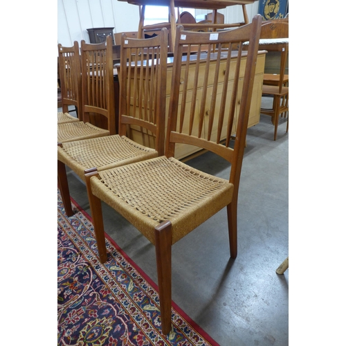 3 - A set of four Danish Mogens Kold teak and cord seated dining chairs, designed by Arne Hovmand Olsen