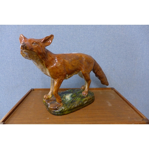 305 - A painted porcelain model of a fox, a/f