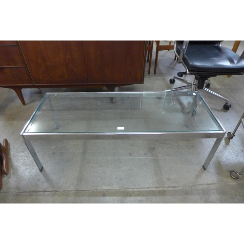 31 - A Merrow Associates chrome and glass topped coffee table, designed by Richard Young