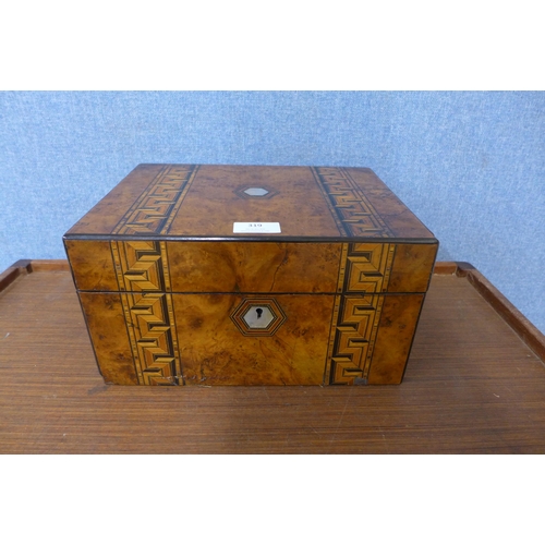 319 - A Victorian inlaid walnut lady's fitted vanity box