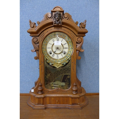 322 - An American Ansonia Clock Co. beech shelf clock