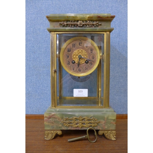 323 - A 19th Century French onyx, gilt metal and four sided glass mantle clock, the movement signed D'Aare... 