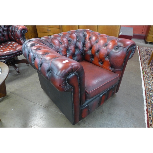 62 - An oxblood red leather Chesterfield club chair