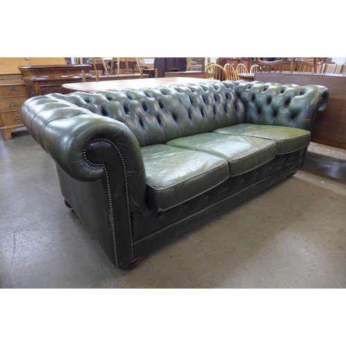 63 - A green leather Chesterfield settee