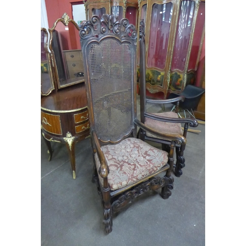 78 - A pair of Carolean style mahogany bergere armchairs