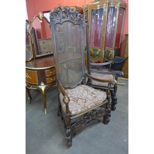 78 - A pair of Carolean style mahogany bergere armchairs