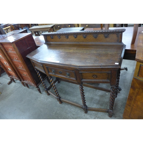 99 - An early 20th Century oak barleytwist three drawer hall table