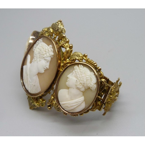 1009 - An antique gilt metal cameo bangle, largest cameo  30mm x 38mm, (small/narrow fitting)