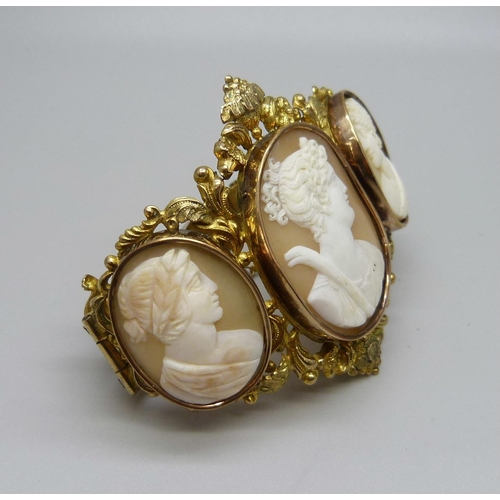 1009 - An antique gilt metal cameo bangle, largest cameo  30mm x 38mm, (small/narrow fitting)