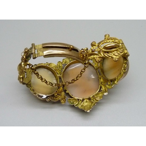 1009 - An antique gilt metal cameo bangle, largest cameo  30mm x 38mm, (small/narrow fitting)