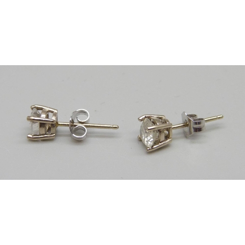 1010 - A pair of 18ct white gold set diamond ear studs, approximately 1 carat diamond weight