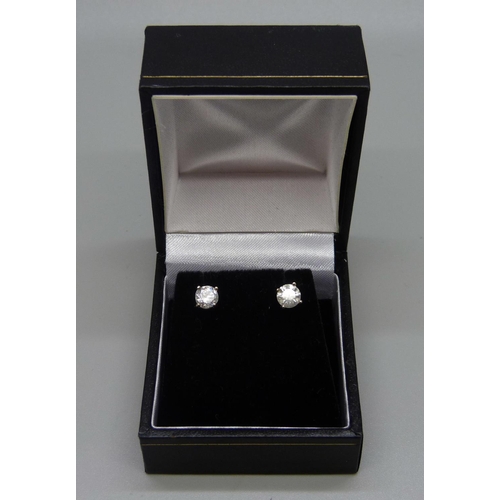 1010 - A pair of 18ct white gold set diamond ear studs, approximately 1 carat diamond weight