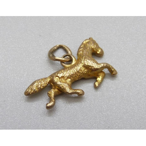 1012 - A hallmarked 9ct gold pony charm, 2g