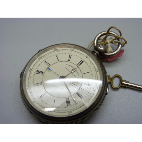 1034 - A silver pocket watch, centre seconds chronograph, Chester 1879