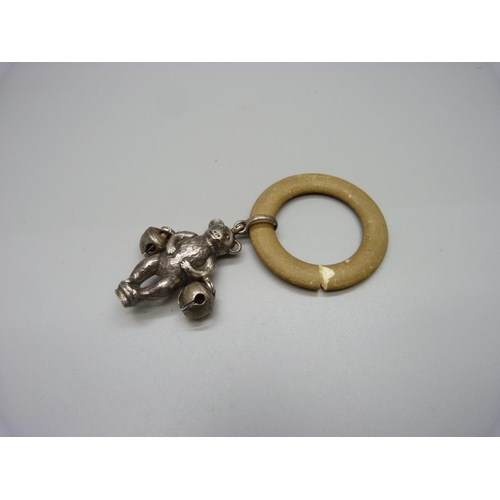 1046 - A silver baby's rattle in the form of a Teddy bear, missing handle