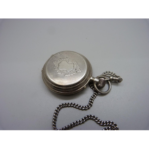 1048 - A white metal full hunter pocket watch, with inscription dated 1889, (tests as silver), on a chain