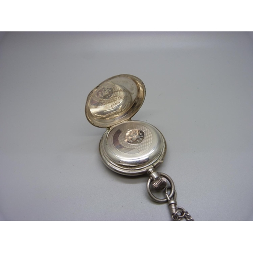 1048 - A white metal full hunter pocket watch, with inscription dated 1889, (tests as silver), on a chain