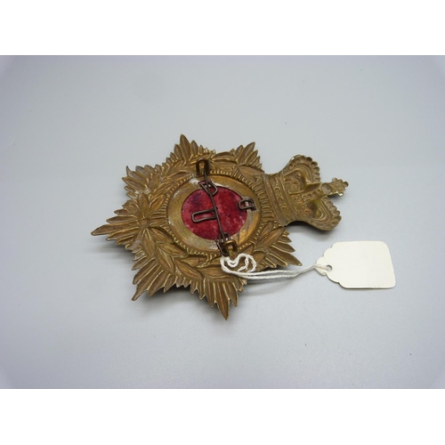 1054 - A Warwickshire helmet badge