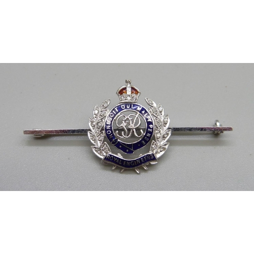 1065 - A George VI white gold Royal Engineers sweetheart brooch set with diamonds and enamelled, the pin ba... 