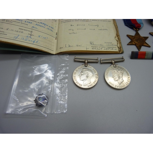 1073 - A Royal Air Force Service and Release Book, a silver and enamel Royal Canadian Air Force badge and f... 