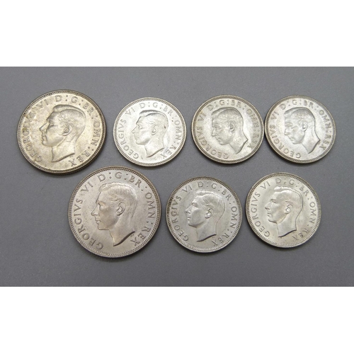 1075 - Seven coins; two 2 shillings 1944 and 1945 and five shillings, 1939, three 1943 and 1945, extra fine