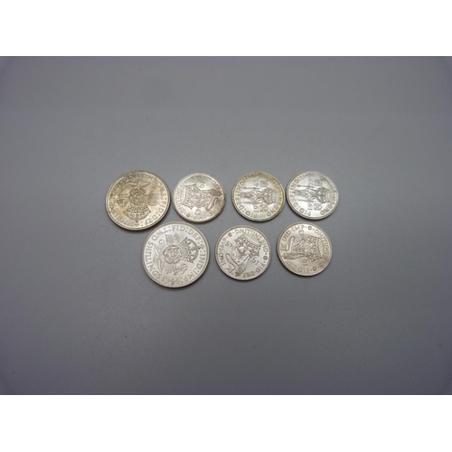 1075 - Seven coins; two 2 shillings 1944 and 1945 and five shillings, 1939, three 1943 and 1945, extra fine