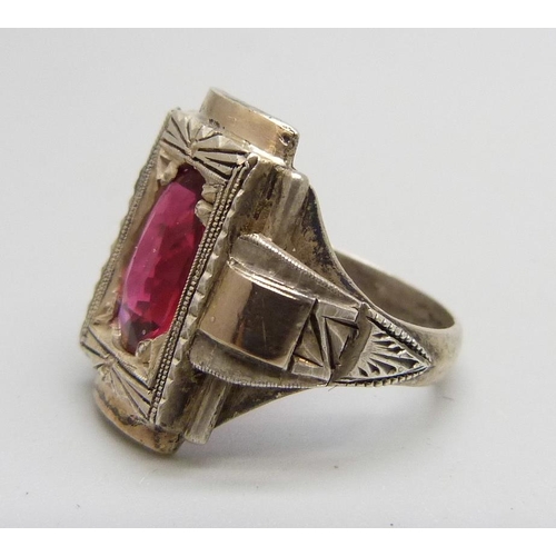 1106 - An Eastern European Art Deco silver ring with applied gold and set with a red stone, J